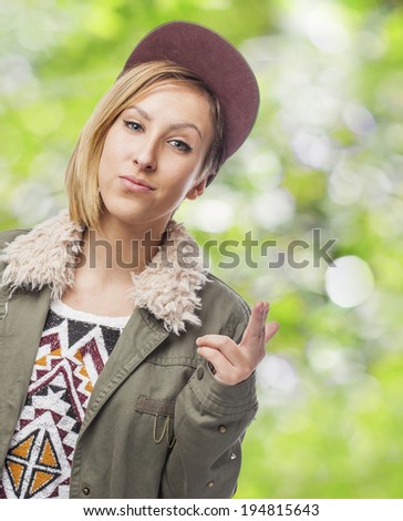 beautiful young woman posing like a hip hop dancer