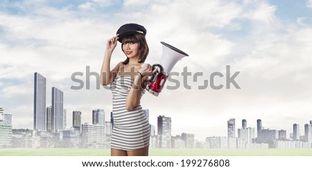 beautiful young woman with sailor cap and megaphone