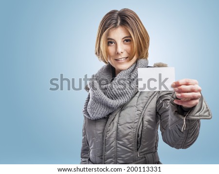 portrait of a pretty young woman showing her white card