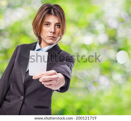 portrait of an executive young woman showing seriously her white card