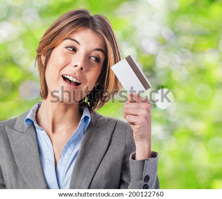 portrait of an executive young woman looking her credit card
