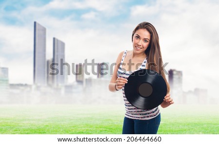 portrait of a young woman holding a vinyl
