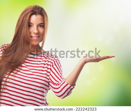 young woman holding something with her hand