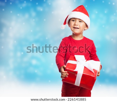 portrait of a little boy receiving a gift