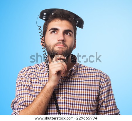 portrait of a young man with the telephone on his head