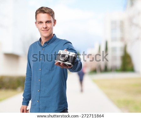 happy young-man with camera