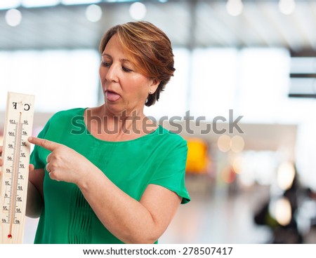 portrait of a mature woman sweating because of the heat