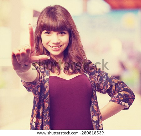 young woman doing a frame gesture