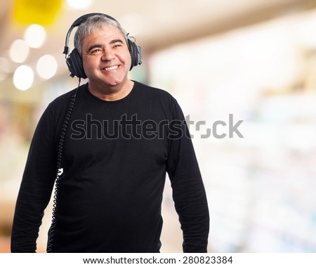 portrait of a mature man listening to music