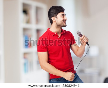 man singing with microphone