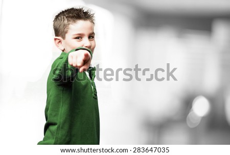 little kid pointing to front