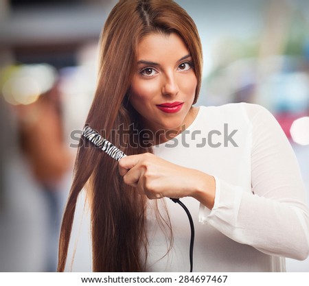 woman using hair irons