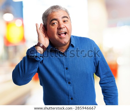 portrait of a mature man trying to hear something