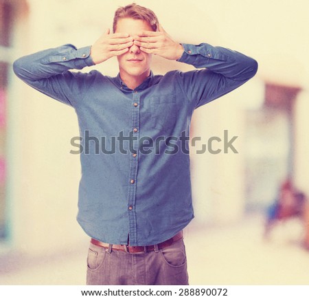cool young-man covering-eyes