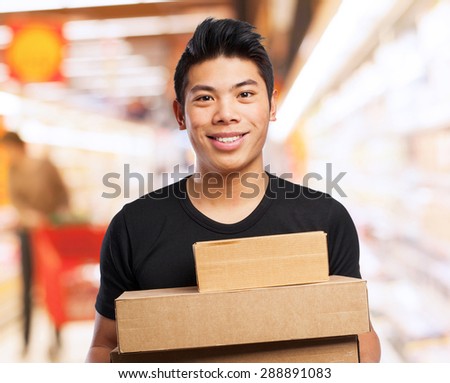 cool chinese-man with boxes