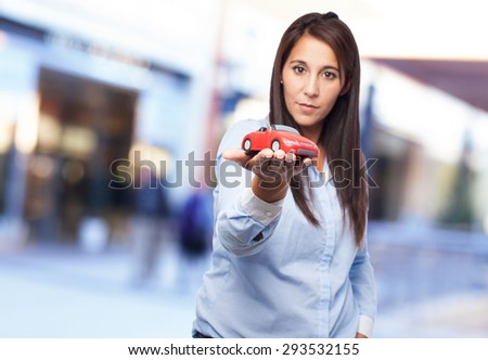 happy young woman with red car