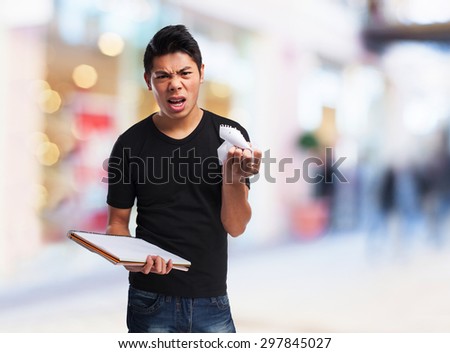 angry chinese man with a notebook