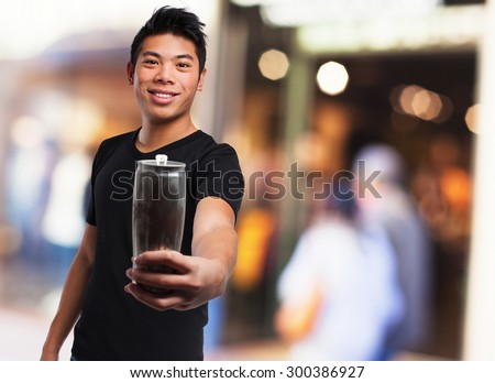 cool chinese man drinking a beer