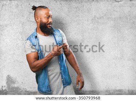 black man pointing to space
