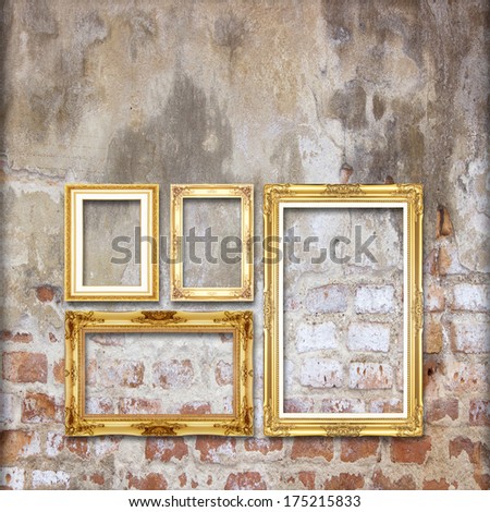 gold antique picture frame on the old brick wall background