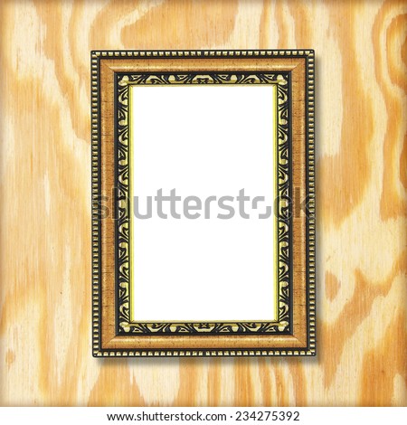 Antique gold frame on wooden wall ;. Empty  picture frame on wooden wall.