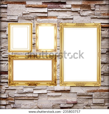 Antique frame on stone wall background ,gold picture frame on sandstone Brick Wall Surfaced background