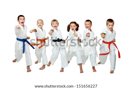 Six young athletes are hitting hand karate kick