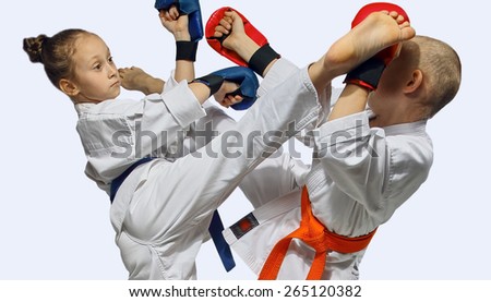 Athletes train karate kicks
