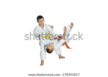 On a white background sportsmens trains judo throws