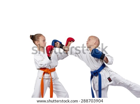 Young athletes with overlays on hands are training  karate blows