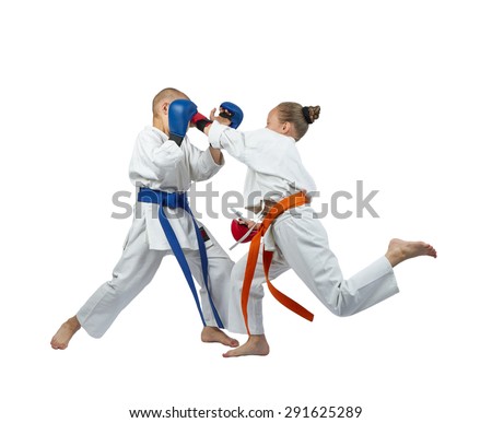 Paired exercises karate kids are training with overlays on his hands
