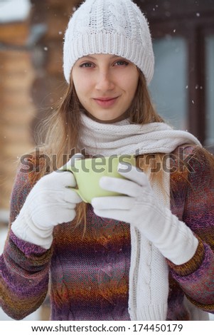 Teenager girl drinking tea