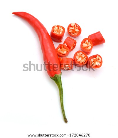 Sliced fresh red chillies isolated on a white background.