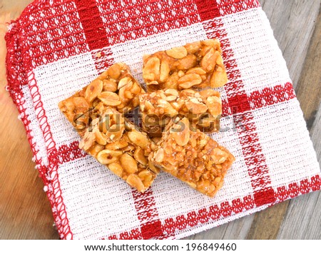 sugar bar with sesame and peanut from china food on wooden board