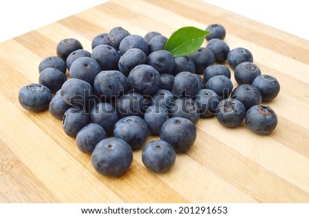 blue berry on wooden board
