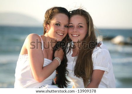 stock photo beautiful teenage girls over sea and sunset background