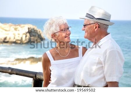 happy elderly couple in love, looking in each other's eyes