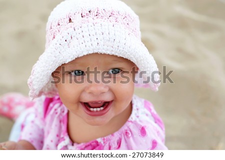 happy baby girl on the beach
