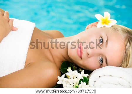 Beautiful young woman in spa