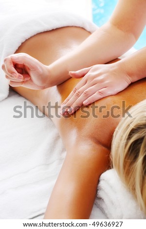 Massage Techniques V - woman receiving professional massage.