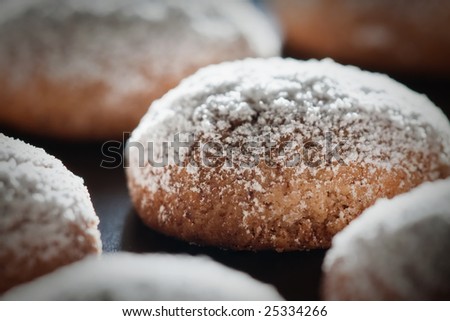 A close up view of a home made biscuit covered with sugar, recipe is simply butter, nuts and sugar.