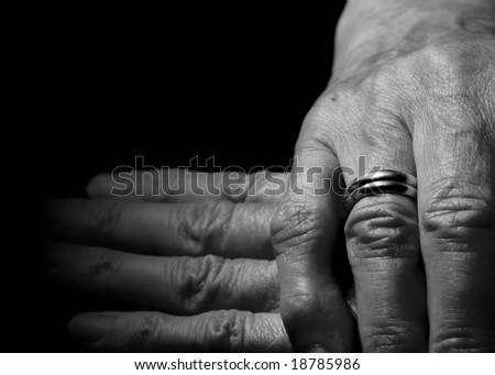 stock photo Female old hand with two wedding rings on the finger on 