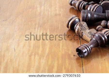 Wooden chess pieces on table made of wood. Empty copy space background presentation business template.