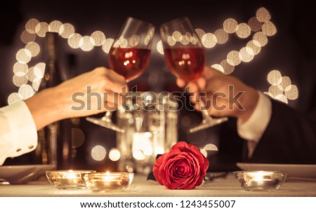 Happy couple having a romantic candle light dinner.
