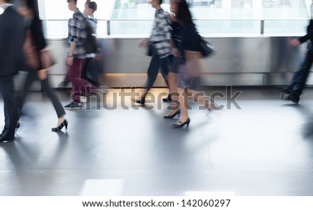 Business people commuting (abstract blurred motion)
