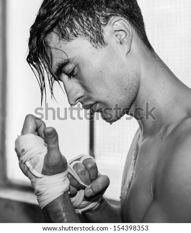 Portrait of male fighter getting ready (black and white)
