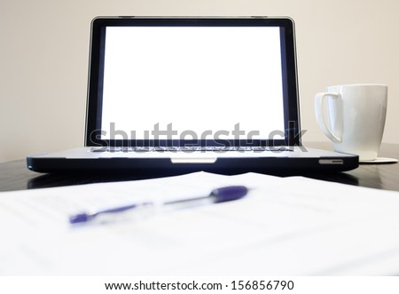 Blank computer screen on office desk