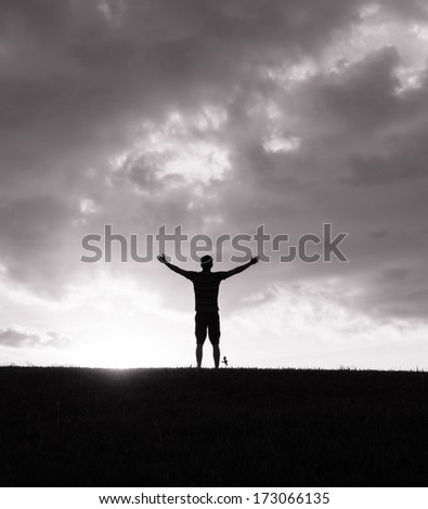 Silhouette Of Happy Young Man Enjoying Nature. Freedom Concept.