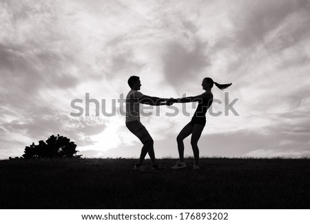 Romantic couple in love dancing outdoors.