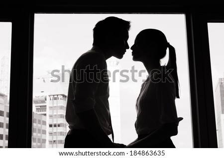 Business love. Business couple kissing in the office. Business affair.